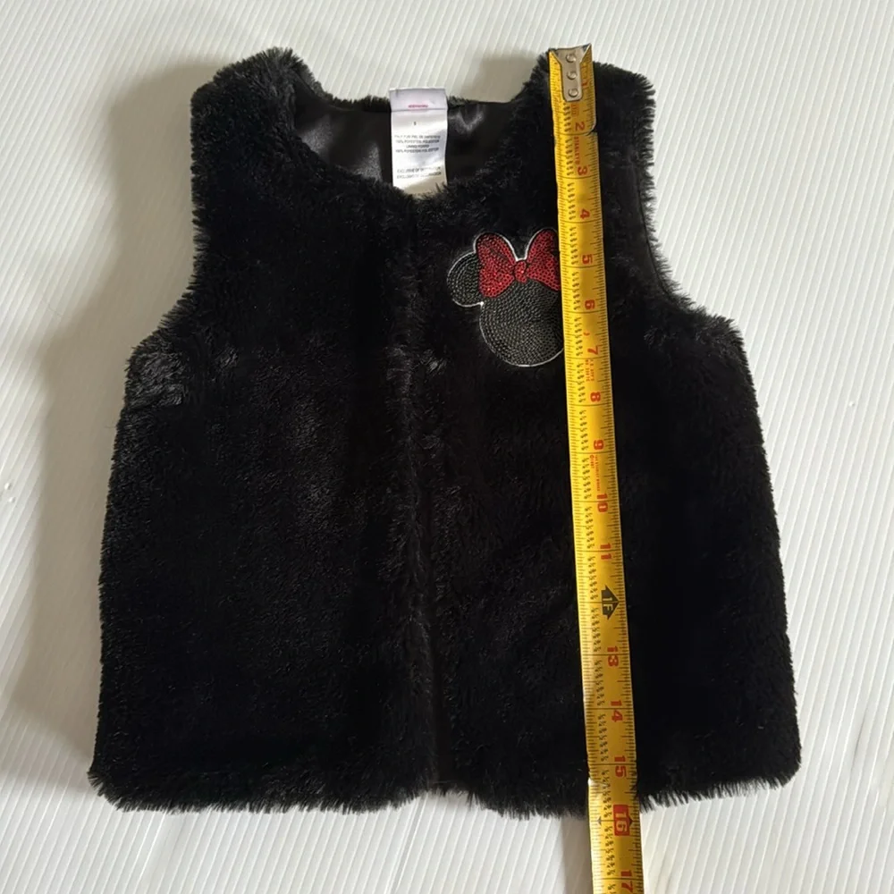 Disney Jr Black faux fur vest with black & red Minnie Mouse patch.  Size 5